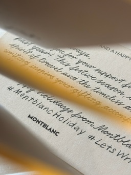 Calligraphy in warm studio light — Lettering in the Cloud